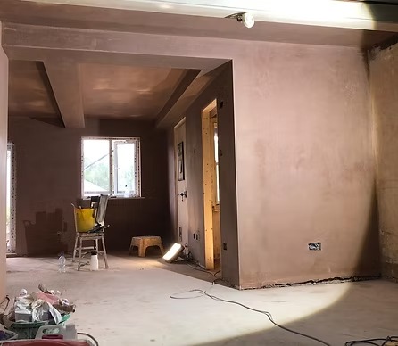 Room interior with fresh plastering